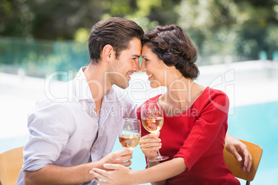 Romantic couple holding white wine