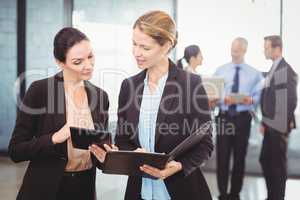 Businesswomen using digital tablet