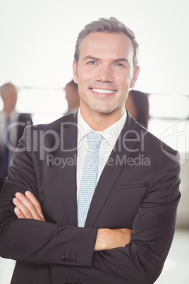 Portrait of young businessman smiling at camera