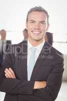 Portrait of young businessman smiling at camera