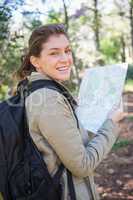 Smiling woman holding the map