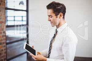 Smart businessman using digital tablet