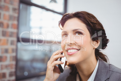 Young businesswoman talking on mobile phone