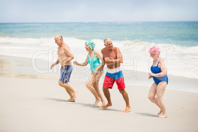 Seniors running at the beach