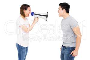 Angry woman shouting at young man on horn loudspeaker
