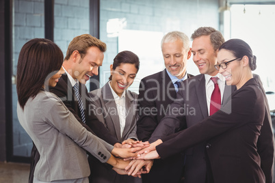 Businesspeople hands stacked over each other