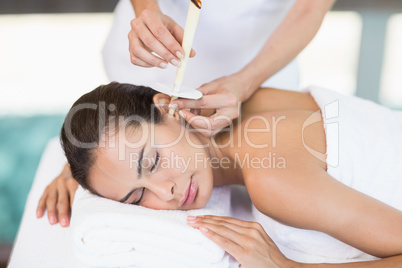 Young woman receiving spa treatment