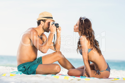 Boyfriend taking picture of girlfriend