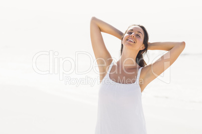 Beautiful woman stretching on the beach