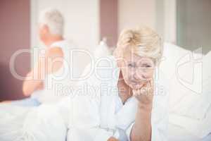 Tensed senior couple on bed