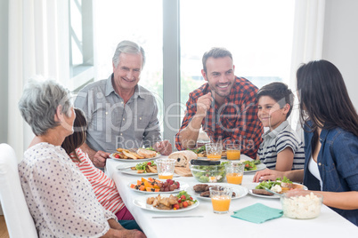 Happy family having breakfast