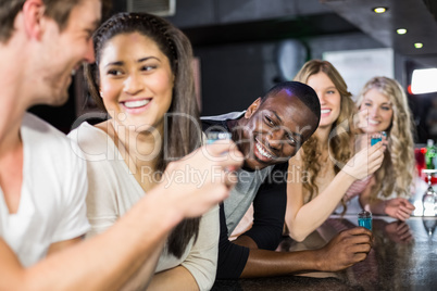 Group of friends having shots