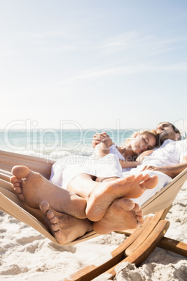 Couple sleeping in hammock