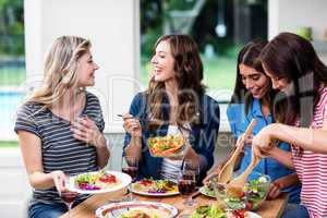 Happy friends having food