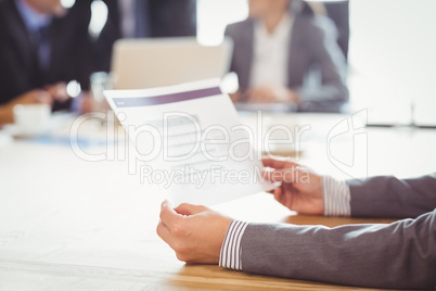 Businesswoman reading a report