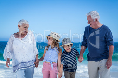 Cute children holding grandparents hands