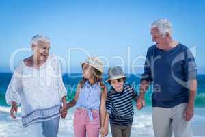 Cute children holding grandparents hands