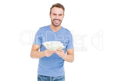 Young man counting currency notes