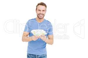 Young man counting currency notes