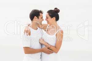 Young couple standing face to face and romancing