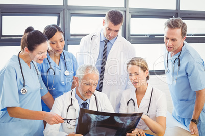 Medical team examining an x-ray report