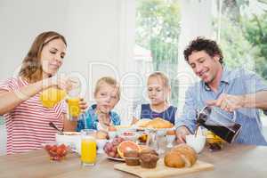 Parents having breakfast with son and daughter