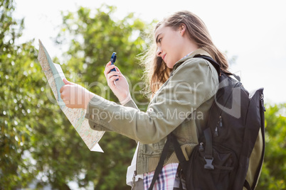 Woman using map and compass