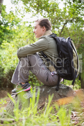Woman sitting on a stone