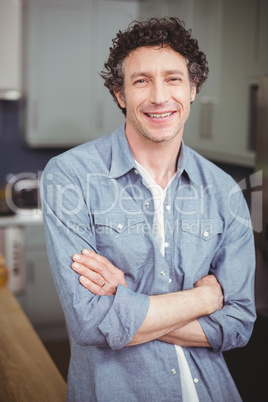 Portrait of smiling young man in kitchen