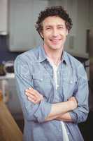 Portrait of smiling young man in kitchen