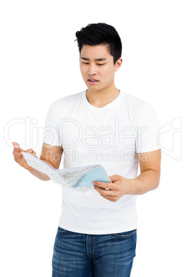 Young man looking at map