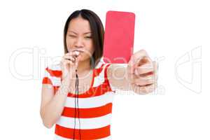 Young woman whistling and showing red card
