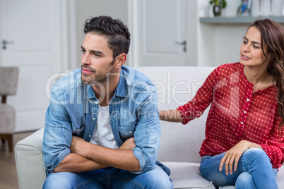 Woman consoling man after argument