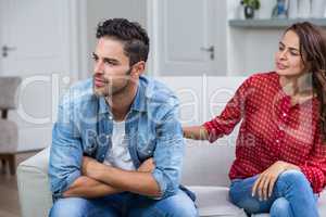 Woman consoling man after argument