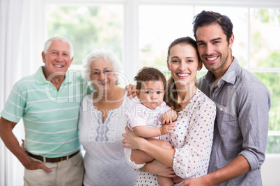 Portrait of happy family with baby