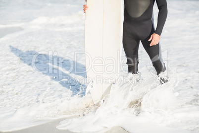 Surfers feet on the beach