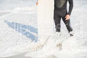 Surfers feet on the beach