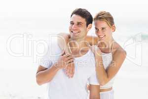 Young couple embracing on the beach