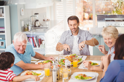 Happy family family having breakfast at home