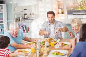 Happy family family having breakfast at home
