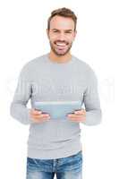 Happy young man using digital tablet