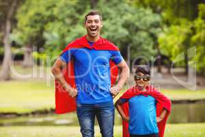 Father and son in superhero costume