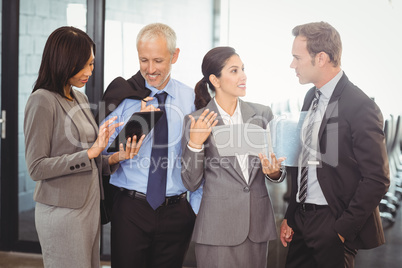 Businesspeople interacting in office