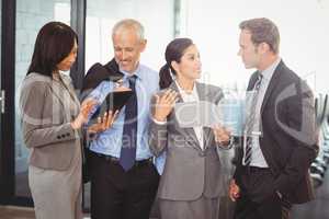 Businesspeople interacting in office