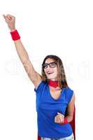 Smiling woman in superhero costume with arm raised