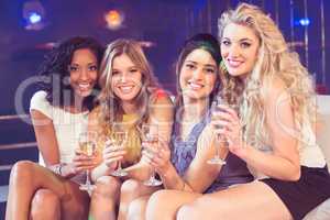 Pretty girls holding champagne glass