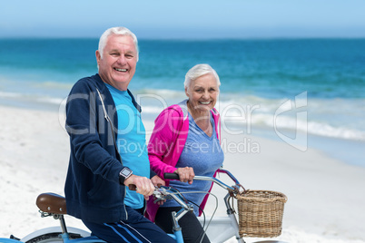 Mature couple riding bicycles