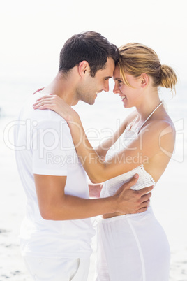 Young couple standing face to face and romancing