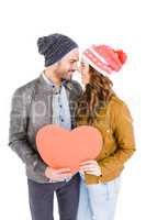 Happy young couple holding heart