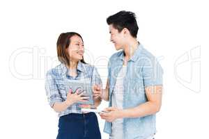 Happy young couple using digital tablet